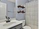 Bathroom featuring a vanity with a white sink, toilet, and decor shelving at 408 Sam Cobb Ct, Woodstock, GA 30188