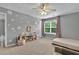 Bedroom with carpet, flower decals, and large windows at 408 Sam Cobb Ct, Woodstock, GA 30188
