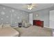 Bedroom featuring neutral walls, carpet flooring, a ceiling fan, and ample natural light at 408 Sam Cobb Ct, Woodstock, GA 30188