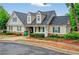 Charming exterior showcasing great curb appeal, a manicured lawn, and attractive landscaping at 408 Sam Cobb Ct, Woodstock, GA 30188