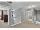 Upstairs hallway with a railing and open doors at 408 Sam Cobb Ct, Woodstock, GA 30188