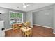Cozy living room featuring hardwood floors, neutral colors, and bright natural light at 408 Sam Cobb Ct, Woodstock, GA 30188