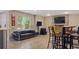 Finished basement featuring a lounge area with a stone fireplace, a wet bar and tile flooring at 6209 Benbrooke Dr, Acworth, GA 30101