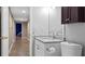Half bathroom with granite vanity, modern fixtures, and a toilet at 6209 Benbrooke Dr, Acworth, GA 30101