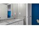 Bathroom featuring a granite countertop double vanity with two doors, leading to other rooms at 6209 Benbrooke Dr, Acworth, GA 30101