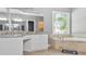 Elegant bathroom boasts a soaking tub, separate vanities, granite counters, and a decorative window at 6209 Benbrooke Dr, Acworth, GA 30101