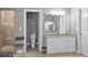 Bright bathroom with granite countertop vanity, shower, and access to toilet for accessibility at 6209 Benbrooke Dr, Acworth, GA 30101