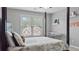 Cozy bedroom with a four-poster bed and view of the neighborhood at 6209 Benbrooke Dr, Acworth, GA 30101