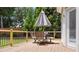 A backyard deck with table and chairs, perfect for outdoor dining and entertaining at 6209 Benbrooke Dr, Acworth, GA 30101