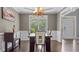 Bright dining room with modern chandelier and large windows at 6209 Benbrooke Dr, Acworth, GA 30101
