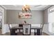 Elegant dining room with modern chandelier and neutral wall color at 6209 Benbrooke Dr, Acworth, GA 30101