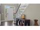 Welcoming foyer with a dark wood console table and staircase at 6209 Benbrooke Dr, Acworth, GA 30101