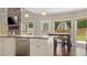 Modern kitchen with stainless steel appliances, granite countertops, and outdoor access at 6209 Benbrooke Dr, Acworth, GA 30101