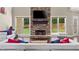 Bright living room with stone fireplace, large windows, hardwood floors, and stylish decor at 6209 Benbrooke Dr, Acworth, GA 30101