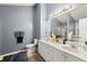 Bathroom featuring a double vanity with framed mirrors and tiled floors at 1647 Tunbridge Ln, Lawrenceville, GA 30043