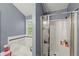 Bathroom featuring a tub, walk-in shower and neutral colors at 1647 Tunbridge Ln, Lawrenceville, GA 30043