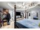 Bedroom featuring a four poster bed and view of the en-suite bathroom at 1647 Tunbridge Ln, Lawrenceville, GA 30043