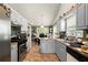 Functional kitchen features stainless appliances, ample countertop space, and custom cabinetry at 1647 Tunbridge Ln, Lawrenceville, GA 30043
