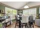 Eat-in kitchen area with bright natural light and breakfast bar with seating at 1647 Tunbridge Ln, Lawrenceville, GA 30043