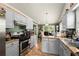 Functional kitchen features stainless appliances, ample countertop space, and custom cabinetry at 1647 Tunbridge Ln, Lawrenceville, GA 30043