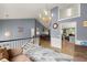 Open-concept living room features high ceilings, chandelier, and views to other living spaces at 1647 Tunbridge Ln, Lawrenceville, GA 30043