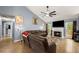 Inviting living room with fireplace, TV, comfortable seating, and access to the outdoor space at 1647 Tunbridge Ln, Lawrenceville, GA 30043