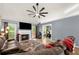 Inviting living room with fireplace, TV, comfortable seating, and access to the outdoor space at 1647 Tunbridge Ln, Lawrenceville, GA 30043