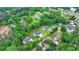 A beautiful aerial view of multiple modern homes nestled among lush greenery and trees at 165 Westbrook St, Buford, GA 30518
