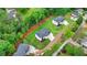 Aerial view of two newly constructed, modern homes, showcasing their well-manicured lawns and contemporary designs at 165 Westbrook St, Buford, GA 30518