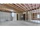 Spacious unfinished basement with exposed ceiling and framing, concrete floor, and staircase access at 165 Westbrook St, Buford, GA 30518
