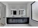 Modern bathroom featuring double vanity with marble countertop and square, lighted mirrors at 165 Westbrook St, Buford, GA 30518