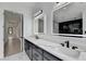 Beautiful bathroom featuring a double vanity, marble countertops, square mirrors, and modern fixtures at 165 Westbrook St, Buford, GA 30518