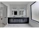 Modern bathroom featuring double sinks, marble countertops, sleek black fixtures, and black framed mirrors at 165 Westbrook St, Buford, GA 30518