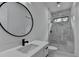 Bright bathroom featuring modern fixtures and a marble tiled glass shower with a bench seat at 165 Westbrook St, Buford, GA 30518