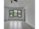 Bright bedroom with large windows providing natural light and a view of the outdoors at 165 Westbrook St, Buford, GA 30518