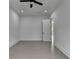 This bedroom features a ceiling fan, recessed lighting, and an open doorway at 165 Westbrook St, Buford, GA 30518