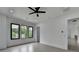 Bright bedroom with large windows offering natural light and backyard view at 165 Westbrook St, Buford, GA 30518