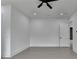 This bedroom features neutral walls, light floors, and a modern ceiling fan at 165 Westbrook St, Buford, GA 30518
