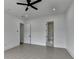 Minimalist bedroom featuring recessed lights, a ceiling fan, and an ensuite bath at 165 Westbrook St, Buford, GA 30518