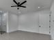 Bedroom featuring light hardwood floors, ceiling fan, recessed lights, and two entry doors at 165 Westbrook St, Buford, GA 30518