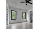 This large bedroom includes a ceiling fan and two windows at 165 Westbrook St, Buford, GA 30518
