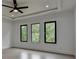 Bedroom featuring three large windows, recessed lighting and ceiling fan at 165 Westbrook St, Buford, GA 30518