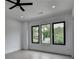 Bright bedroom with large windows providing natural light and a view of the outdoors at 165 Westbrook St, Buford, GA 30518