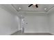 Spacious bedroom features a tray ceiling, recessed lighting, and neutral wall color at 165 Westbrook St, Buford, GA 30518