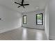 Bedroom featuring wood-look flooring, a modern ceiling fan, and beautiful natural light at 165 Westbrook St, Buford, GA 30518