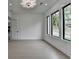 Bonus room featuring large windows, recessed lights, light hardwood floors and lots of natural light at 165 Westbrook St, Buford, GA 30518