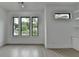 Bonus room featuring built in shelving, large windows, recessed lights, and light hardwood floors at 165 Westbrook St, Buford, GA 30518