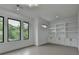 Bonus room featuring built in shelving, large windows, recessed lights, and light hardwood floors at 165 Westbrook St, Buford, GA 30518