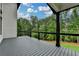 An expansive covered deck provides the perfect outdoor living space at 165 Westbrook St, Buford, GA 30518