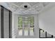 This foyer features a modern ceiling with contemporary light fixture and a wall of windows at 165 Westbrook St, Buford, GA 30518